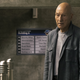Patrick Stewart as Jean-Luc Picard, standing in an empty corridor. He is surrounded by metallic crates.